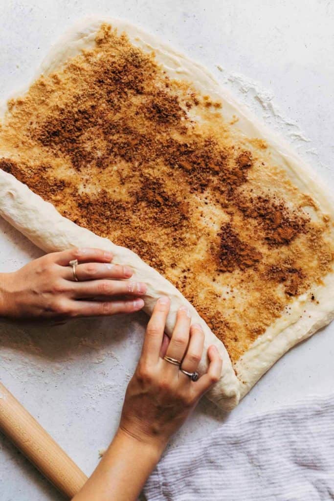 rolling up cinnamon roll dough
