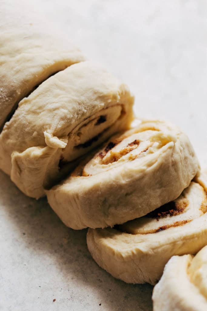 close up on sliced cinnamon roll dough