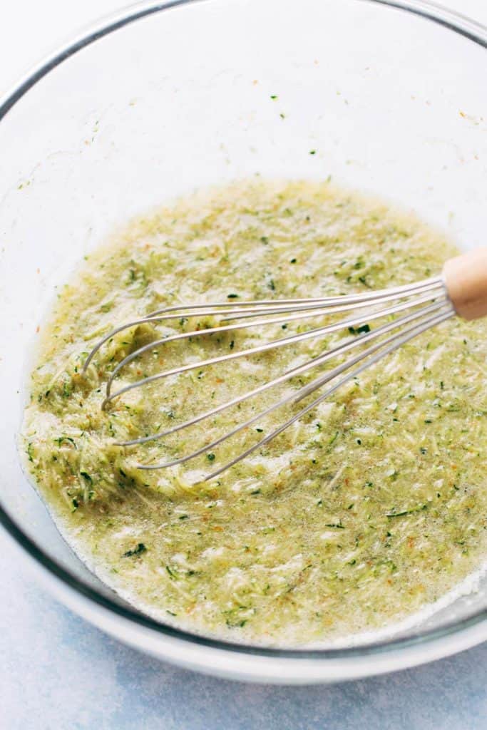 a bowl of zucchini muffin wet ingredients