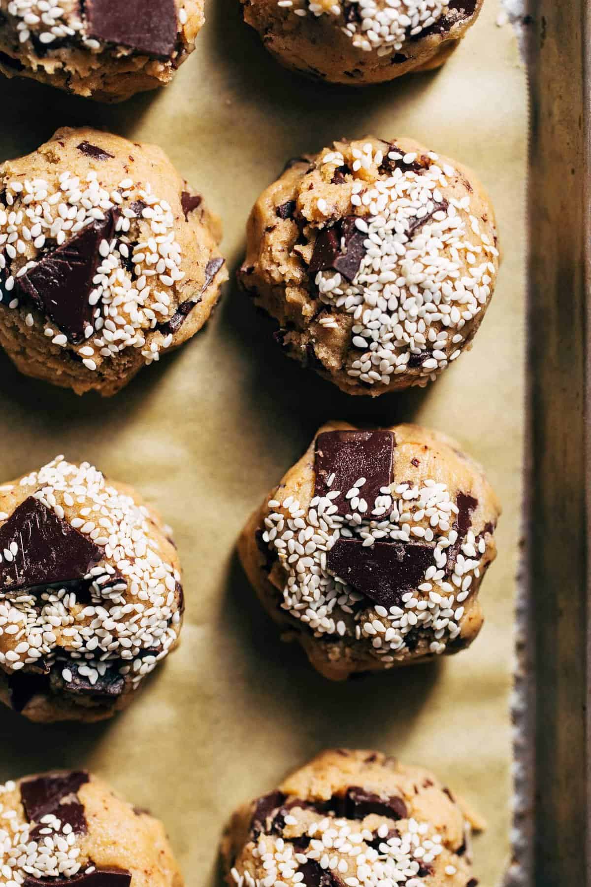 scooped cookie dough balls on a sheet tray
