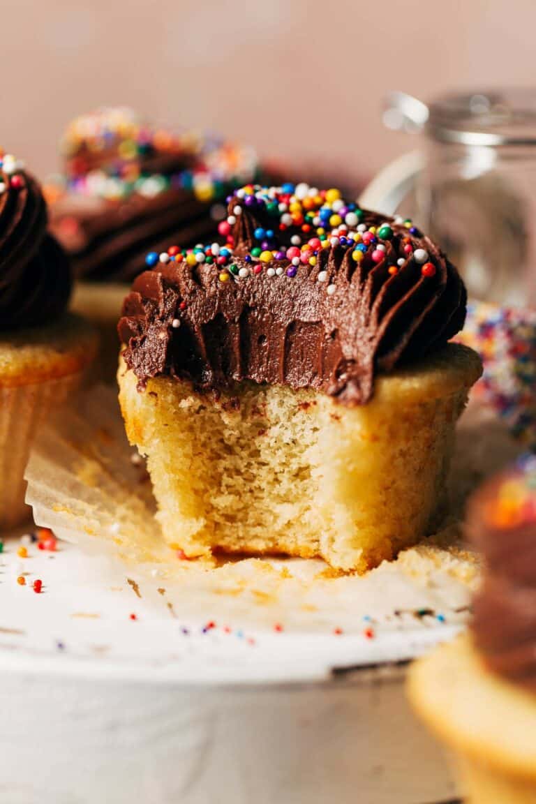 a bite taken from a gluten free cupcake