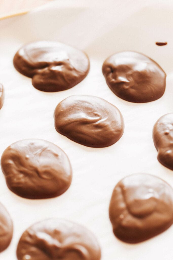 dollops of chocolate on parchment paper